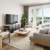 a living room with a tv and couches