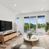 a living room with a tv and couches