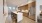 a kitchen with a fridge and a dining table