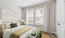 bedroom with large windows and lamps